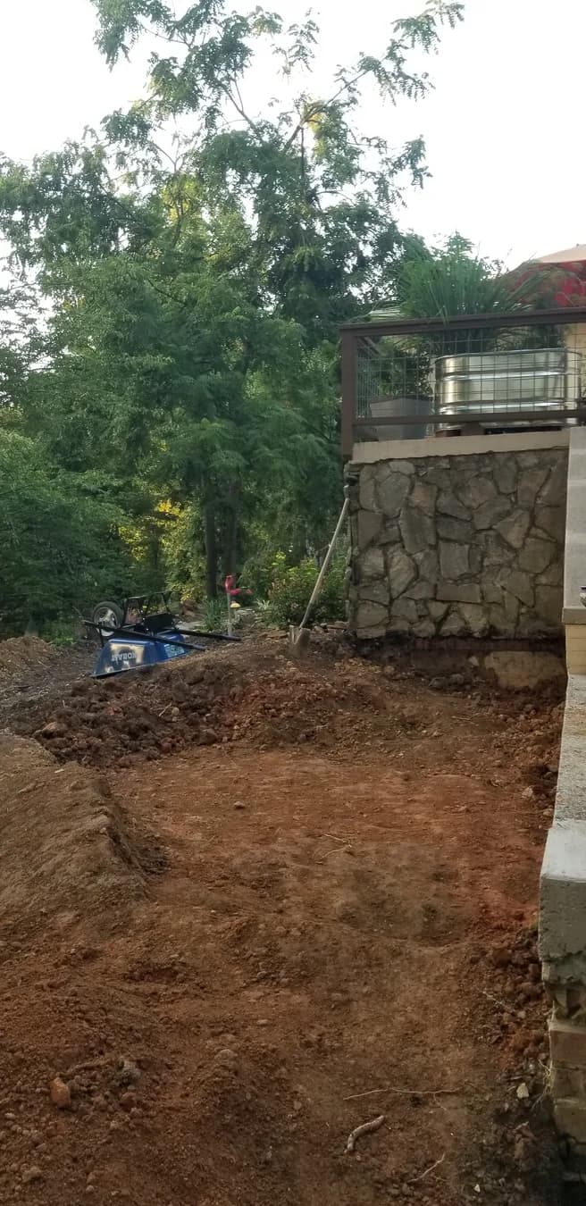 Flagstone walk site preparation at the stone wall and garden edge, view 2