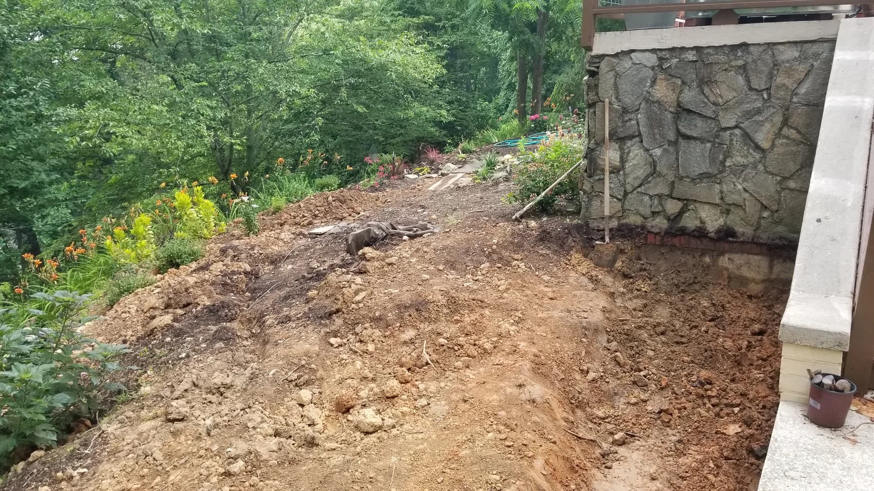 Flagstone walk site preparation through the planted garden edge, view 3