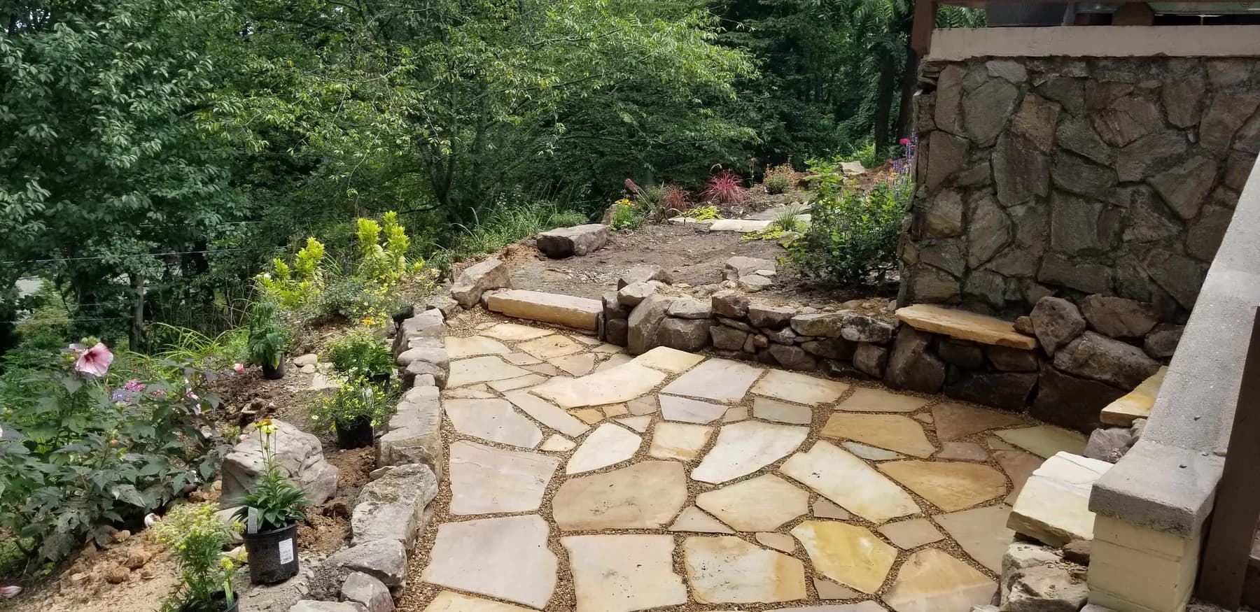 Finished flagstone walk with pea gravel joints and garden planting