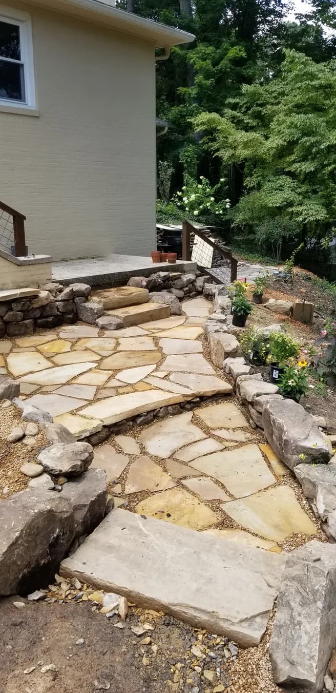 Flagstone landing and walk with pea gravel joints near stone steps