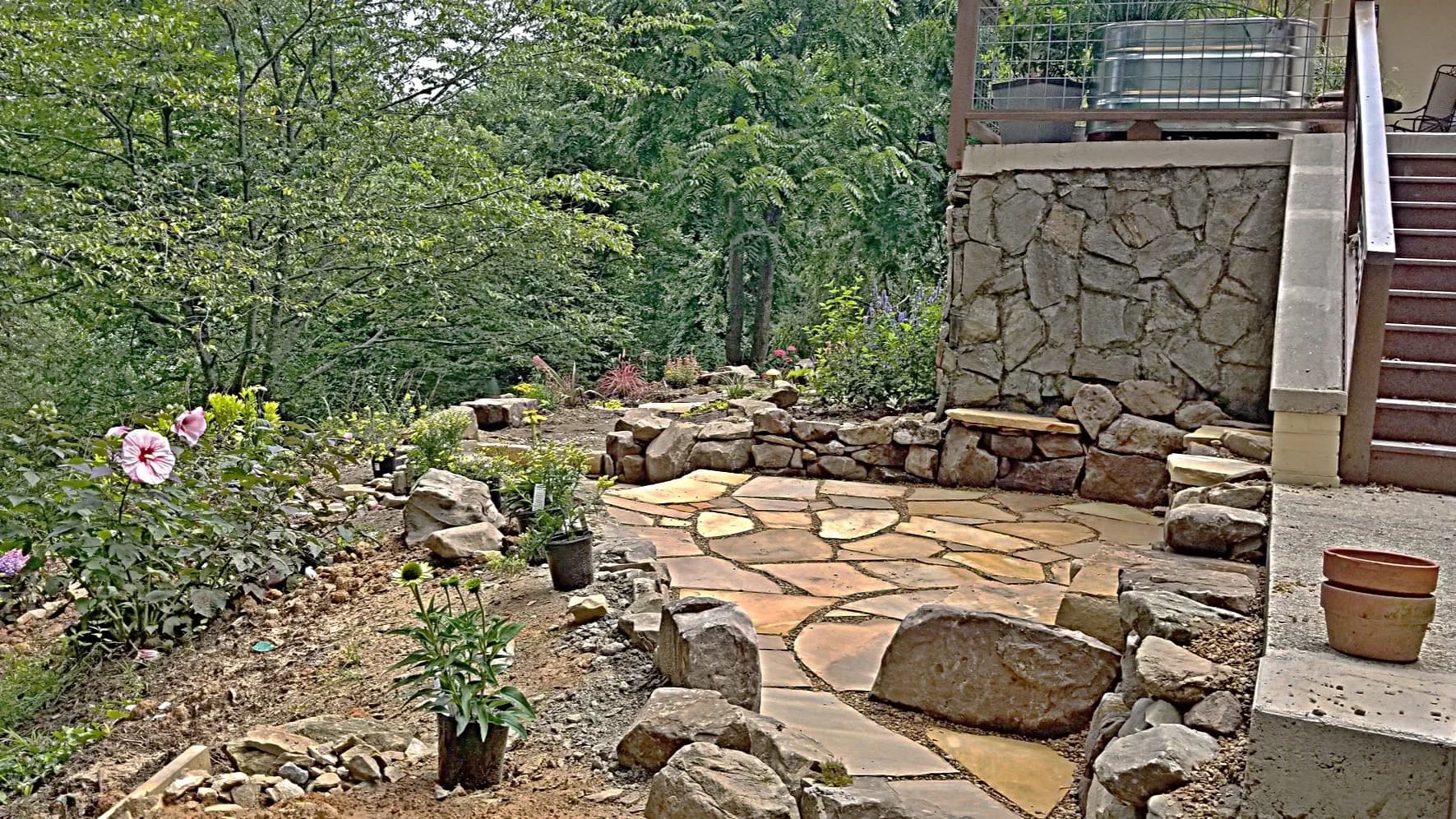 Flagstone walk with pea gravel joints and planted edges, view 8