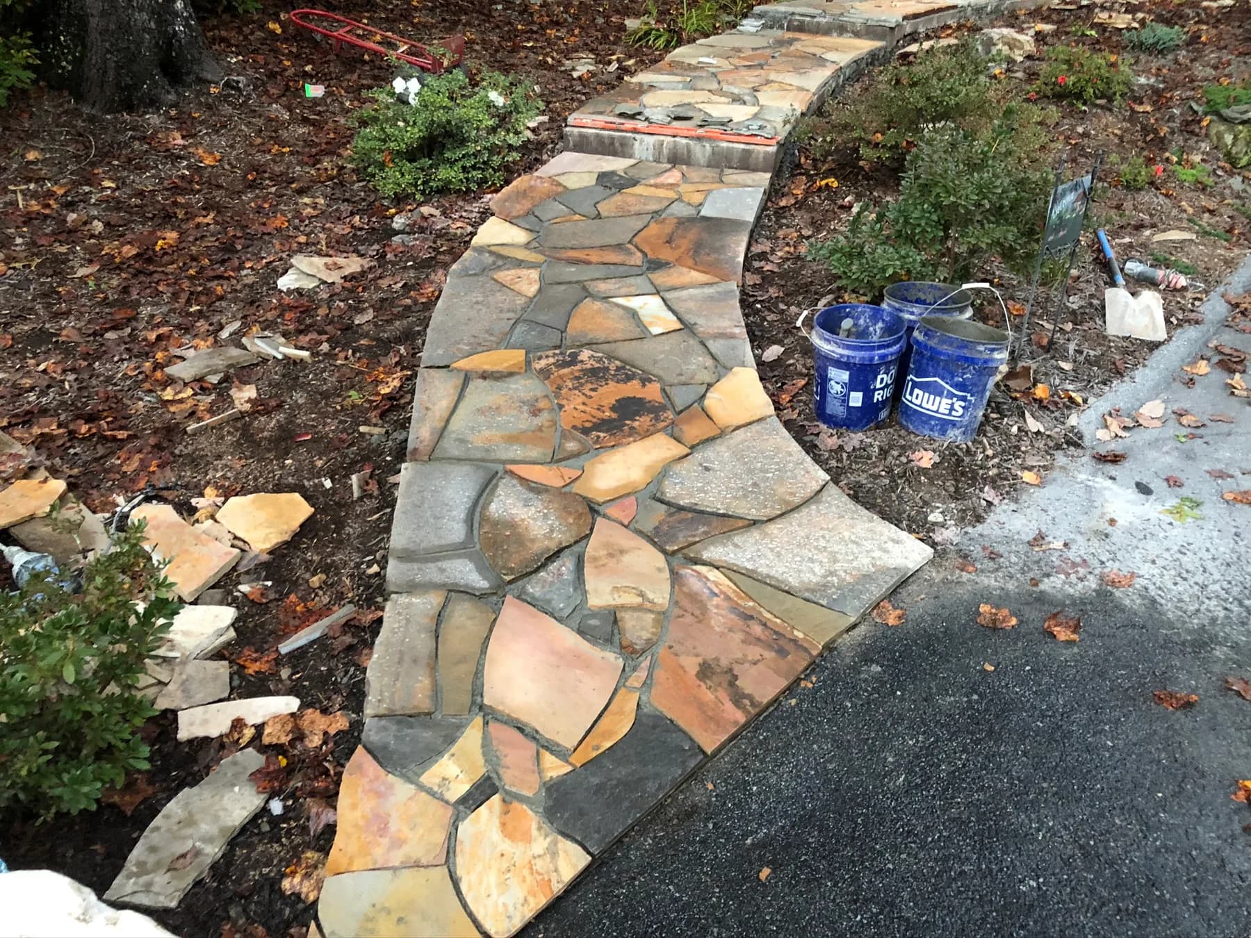 Mortared flagstone walkway with curved border and planting edge, view 11