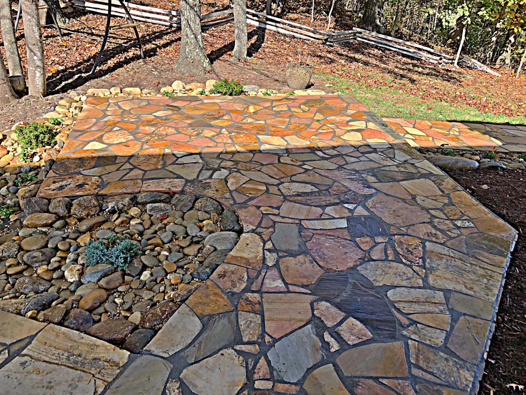 Mortared flagstone landing with stone edge and planting area