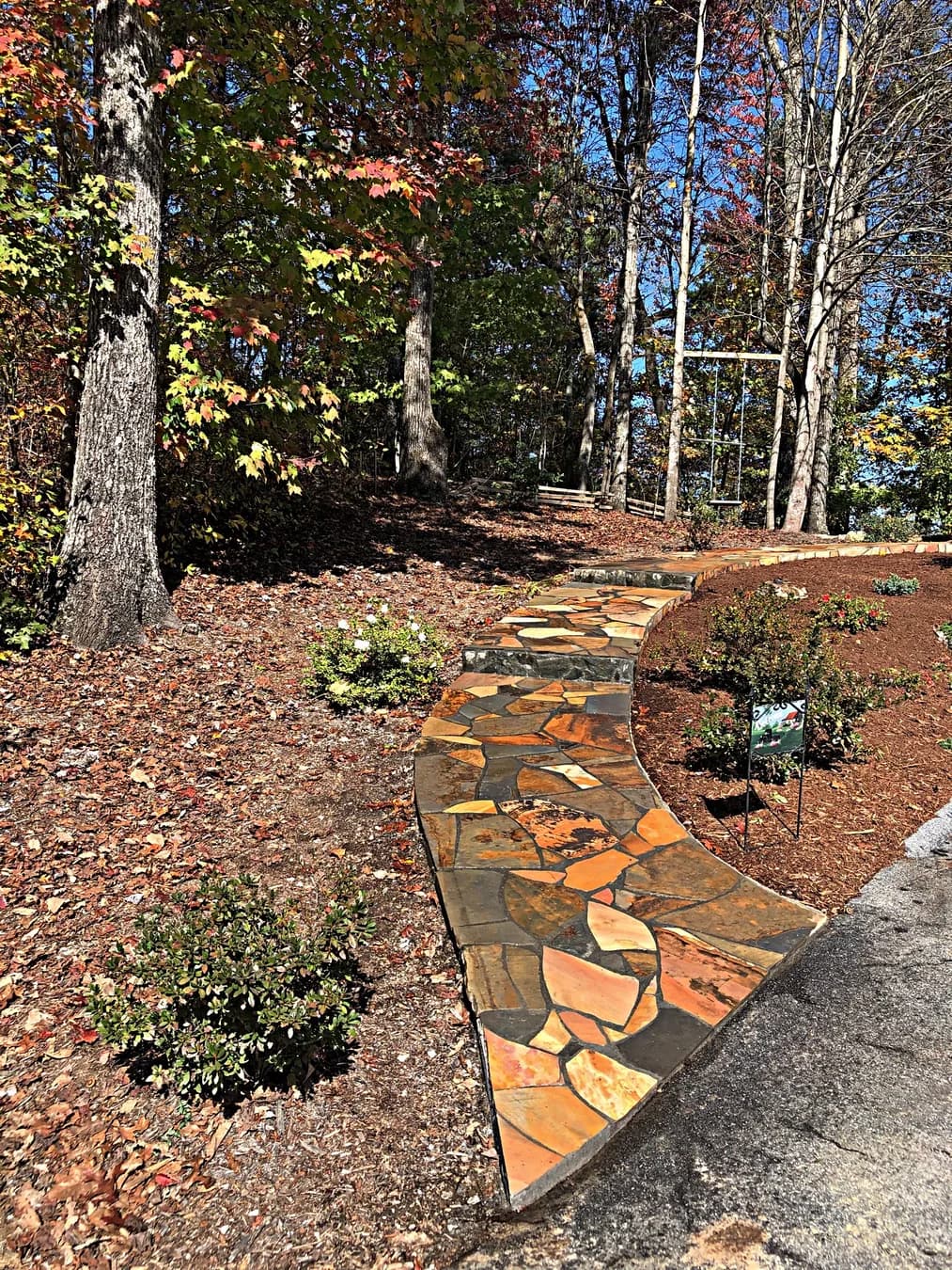 Mortared flagstone walkway with curved transition and planted edge, view 17