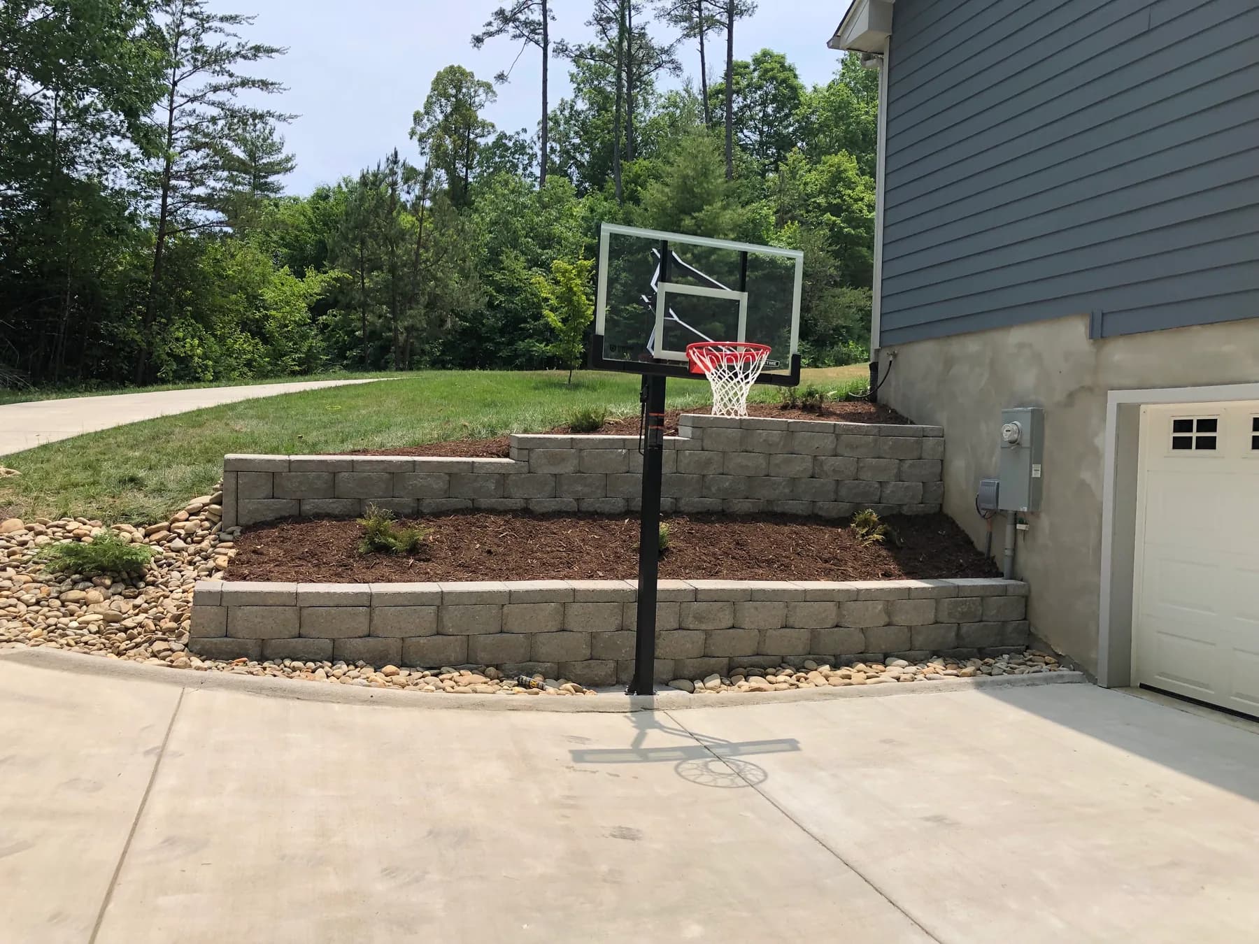 Masonry site wall work along a residential recreation edge