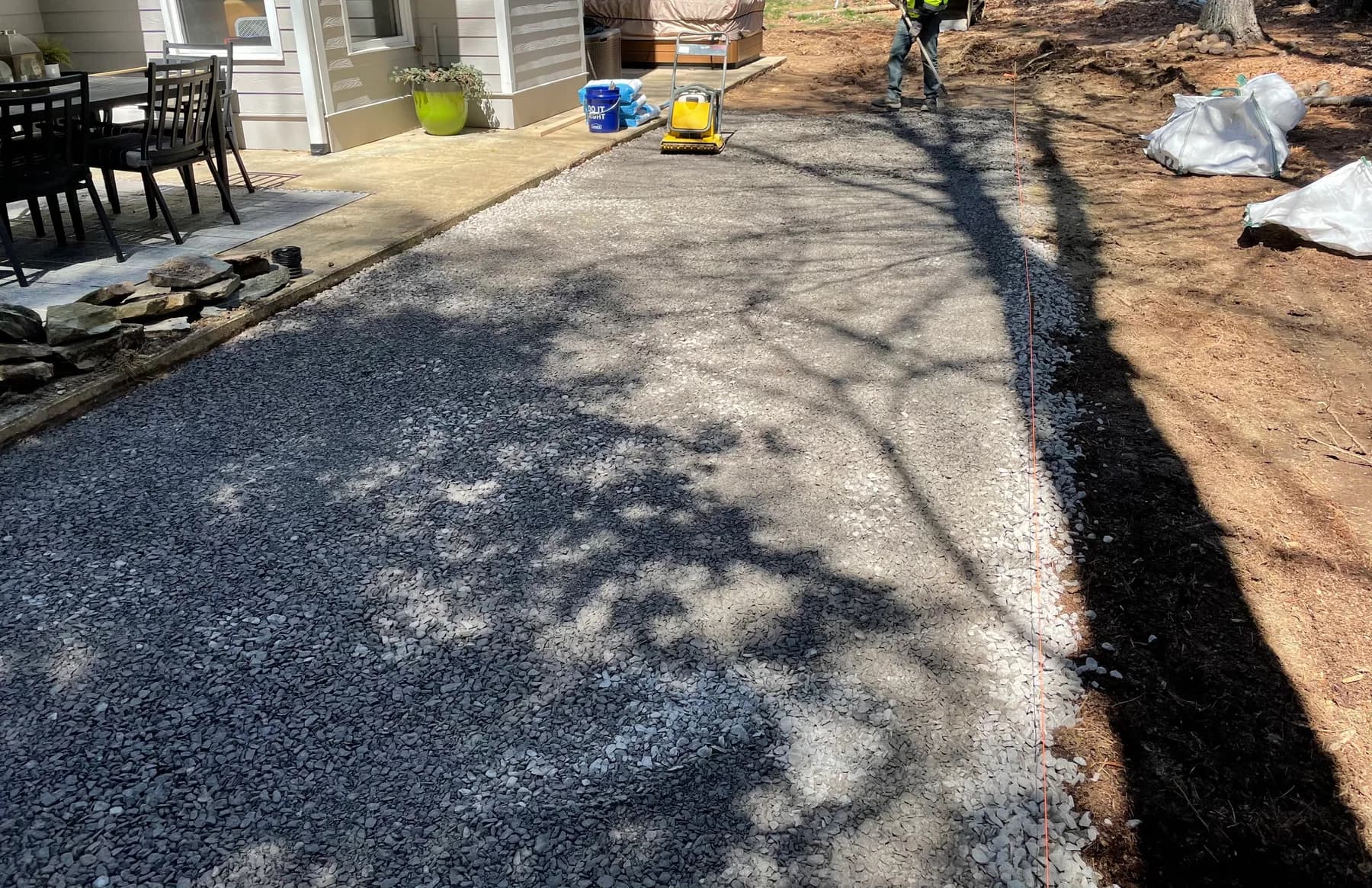 Woodland stone patio project with stone surfacing, border work, and outdoor seating area, view 3