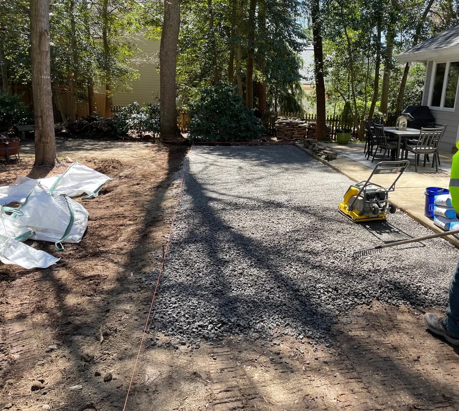 Woodland stone patio project with stone surfacing, border work, and outdoor seating area, view 4